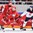 ST. PETERSBURG, RUSSIA - MAY 11: Slovakia's Juraj Mikus #26 reaches to pull the puck away from Belarus' Alexander Kitarov #77 and Nikita Komarov #19 during preliminary round action at the 2016 IIHF Ice Hockey World Championship. (Photo by Minas Panagiotakis/HHOF-IIHF Images)

